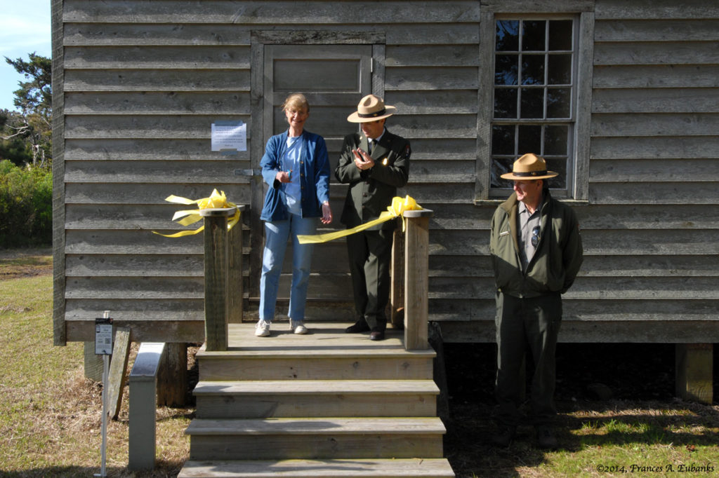 Jean Webber Cuts Ribbon At Dedication of Washington Roberts House.